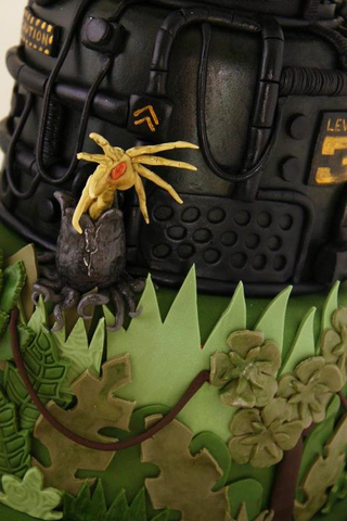 Illustration for article titled This Alien versus Predator wedding cake is disturbingly adorable